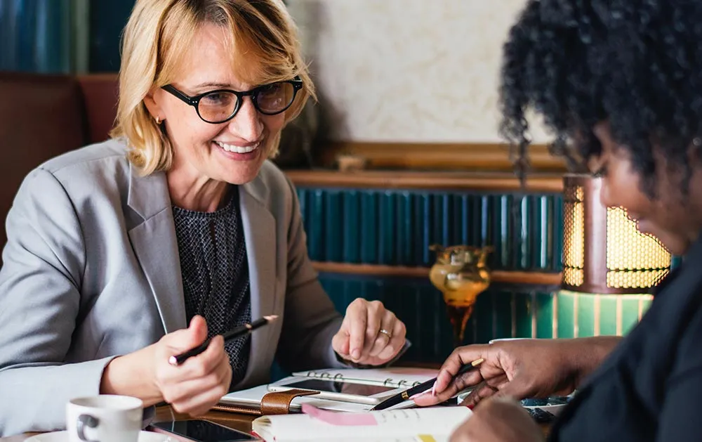Advisor reviewing financial documents with a client